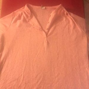 A baby pink blouse that has a nice breathable fabric